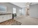 Open floor plan featuring a kitchen, living area, and neutral-toned walls at 977 Edinburgh Fields Ct, Las Vegas, NV 89138