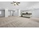 Open living area with recessed lighting, ceiling fans, and a view of the kitchen and entryway at 977 Edinburgh Fields Ct, Las Vegas, NV 89138