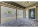 Inviting covered patio with a brick floor, offering seamless indoor-outdoor living and a tranquil desert view at 977 Edinburgh Fields Ct, Las Vegas, NV 89138