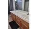 Bathroom with walk-in shower, dual vanity, wood cabinets, and wood-look floors at , Henderson, NV 89002