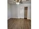 A large bedroom shows vinyl floors, neutral paint, and ceiling fan at , Henderson, NV 89002