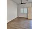 Bright entryway showcases neutral paint, wood-look floors, white door and window shutters at , Henderson, NV 89002