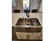 Stainless steel farm sink with white shaker cabinets and marble countertops at , Henderson, NV 89002