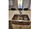 Stainless steel farm sink with white shaker cabinets and marble countertops at , Henderson, NV 89002