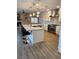 Modern kitchen boasts a large center island with barstool seating and stainless steel appliances at , Henderson, NV 89002