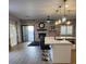 Open living space features an eat-in kitchen area, lots of light and an accent wall with a fireplace at , Henderson, NV 89002