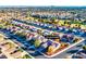 Beautiful aerial view of a single Gathering home with a well manicured yard in a quiet neighborhood and desert landscaping at 10125 Hope Island Dr, Las Vegas, NV 89134