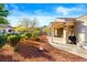 The backyard includes a covered patio and beautiful desert landscaping at 10125 Hope Island Dr, Las Vegas, NV 89134