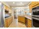 Well-lit kitchen with stainless steel appliances and a view of the dining nook at 10125 Hope Island Dr, Las Vegas, NV 89134