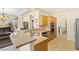 Modern kitchen featuring granite counters, stainless steel appliances, and adjacent living area at 10125 Hope Island Dr, Las Vegas, NV 89134