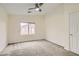 Neutral bedroom offering plush carpeting, ceiling fan, and a bright window with neighborhood views at 10147 Aspen Rose St # 101, Las Vegas, NV 89183