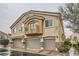 Charming townhome with private garages, a balcony and inviting curb appeal in a well-maintained community at 10147 Aspen Rose St # 101, Las Vegas, NV 89183