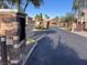 Gated community entrance with stone guardhouse providing security and privacy for residents at 10147 Aspen Rose St # 101, Las Vegas, NV 89183
