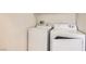Bright laundry room featuring a white washer and dryer for convenient in-home laundry at 10147 Aspen Rose St # 101, Las Vegas, NV 89183