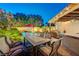 A serene backyard oasis featuring a refreshing pool, comfortable seating, and lush landscaping for outdoor enjoyment at 1028 Dodger Blue Ave, Las Vegas, NV 89123