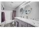 Bathroom featuring double sinks, granite countertops, and a shower-tub combo at 1028 Dodger Blue Ave, Las Vegas, NV 89123