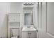 This bathroom has an over the toilet cabinet for additional storage at 1028 Dodger Blue Ave, Las Vegas, NV 89123