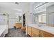 This bathroom includes dual sinks, a walk-in shower, and a separate tub at 1028 Dodger Blue Ave, Las Vegas, NV 89123