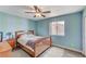 Comfortable bedroom with ample natural light, and wood flooring at 1028 Dodger Blue Ave, Las Vegas, NV 89123