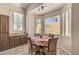 Cozy breakfast nook with sunlit windows, built-in storage, and seating for four, perfect for casual dining at 1028 Dodger Blue Ave, Las Vegas, NV 89123
