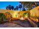 Cozy fire pit area featuring comfortable seating, lush greenery, and ambient lighting creating a relaxing outdoor space at 1028 Dodger Blue Ave, Las Vegas, NV 89123