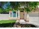 Inviting home facade featuring a well-maintained lawn, landscaped yard, and a cozy covered entrance at 1028 Dodger Blue Ave, Las Vegas, NV 89123