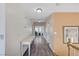 Hallway with hardwood floors featuring neutral colored walls and a vintage console table at 1028 Dodger Blue Ave, Las Vegas, NV 89123