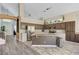 Open-concept kitchen with stainless steel appliances, a large island, and hardwood floors at 1028 Dodger Blue Ave, Las Vegas, NV 89123