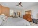 Stylish main bedroom with wood-look floors, dresser, and access to the en-suite bathroom for added convenience at 1028 Dodger Blue Ave, Las Vegas, NV 89123
