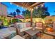 Beautiful patio featuring comfortable wicker seating and stylish decor, ideal for relaxing and entertaining guests outdoors at 1028 Dodger Blue Ave, Las Vegas, NV 89123