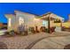 An inviting outdoor living space with a stylish pergola, built-in grill, and well-manicured landscaping for ultimate relaxation at 1028 Dodger Blue Ave, Las Vegas, NV 89123