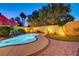 Sparkling swimming pool with lush landscaping, an umbrella, and a putting green creating a backyard oasis at 1028 Dodger Blue Ave, Las Vegas, NV 89123