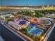 Aerial view showcasing the backyard oasis with pool, lounge area, and golf putting green at 10319 Larkmead Ave, Las Vegas, NV 89149