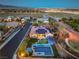 Aerial view of single Gathering home with a backyard pool, putting green and solar panels at 10319 Larkmead Ave, Las Vegas, NV 89149
