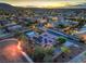 Aerial view of the luxury home featuring pool, putting green and solar panels at 10319 Larkmead Ave, Las Vegas, NV 89149