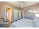 Bedroom with ceiling fan, double closets and neutral color scheme at 10319 Larkmead Ave, Las Vegas, NV 89149