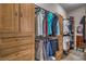 A custom walk-in closet with built-in shelving and plenty of room for storage at 10319 Larkmead Ave, Las Vegas, NV 89149