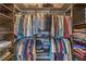 This walk-in closet features custom built-in shelving for optimal organization at 10319 Larkmead Ave, Las Vegas, NV 89149
