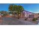 Charming single-story home with desert landscaping and a brick paved driveway at 10319 Larkmead Ave, Las Vegas, NV 89149