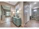 This hallway features an antique style cabinet and access to the main bathroom and bedroom at 10319 Larkmead Ave, Las Vegas, NV 89149
