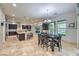 Spacious kitchen with ample counter space, dark cabinetry, and adjacent dining area filled with natural light at 10319 Larkmead Ave, Las Vegas, NV 89149