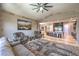 Open-concept living room featuring tile floors, a wet bar, and a seamless flow to the gourmet kitchen at 10319 Larkmead Ave, Las Vegas, NV 89149
