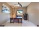 Spacious office with a large desk, file cabinet, and natural light at 10319 Larkmead Ave, Las Vegas, NV 89149