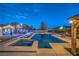 Backyard oasis featuring a pool, spa, and outdoor bar, creating a luxurious and relaxing outdoor space at 10319 Larkmead Ave, Las Vegas, NV 89149