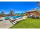 Lounge by the pool and spa, relax under the covered patio, or enjoy the manicured lawn and landscaping at 10319 Larkmead Ave, Las Vegas, NV 89149