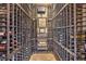 Custom wine cellar with extensive storage racks for wine collection, creating a sophisticated tasting experience at 10319 Larkmead Ave, Las Vegas, NV 89149