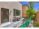 Private backyard with mature tree provides shade over patio table at 10353 Yew Blossom Ave, Las Vegas, NV 89166