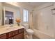 Functional bathroom with tub-shower combo, vanity with sink, and well-lit mirror at 10353 Yew Blossom Ave, Las Vegas, NV 89166
