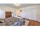 Comfortable bedroom featuring wood floors, ample closet space, and neutral decor at 10353 Yew Blossom Ave, Las Vegas, NV 89166