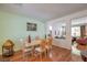Bright dining room with hardwood floors and stylish decor, open to living area at 10353 Yew Blossom Ave, Las Vegas, NV 89166